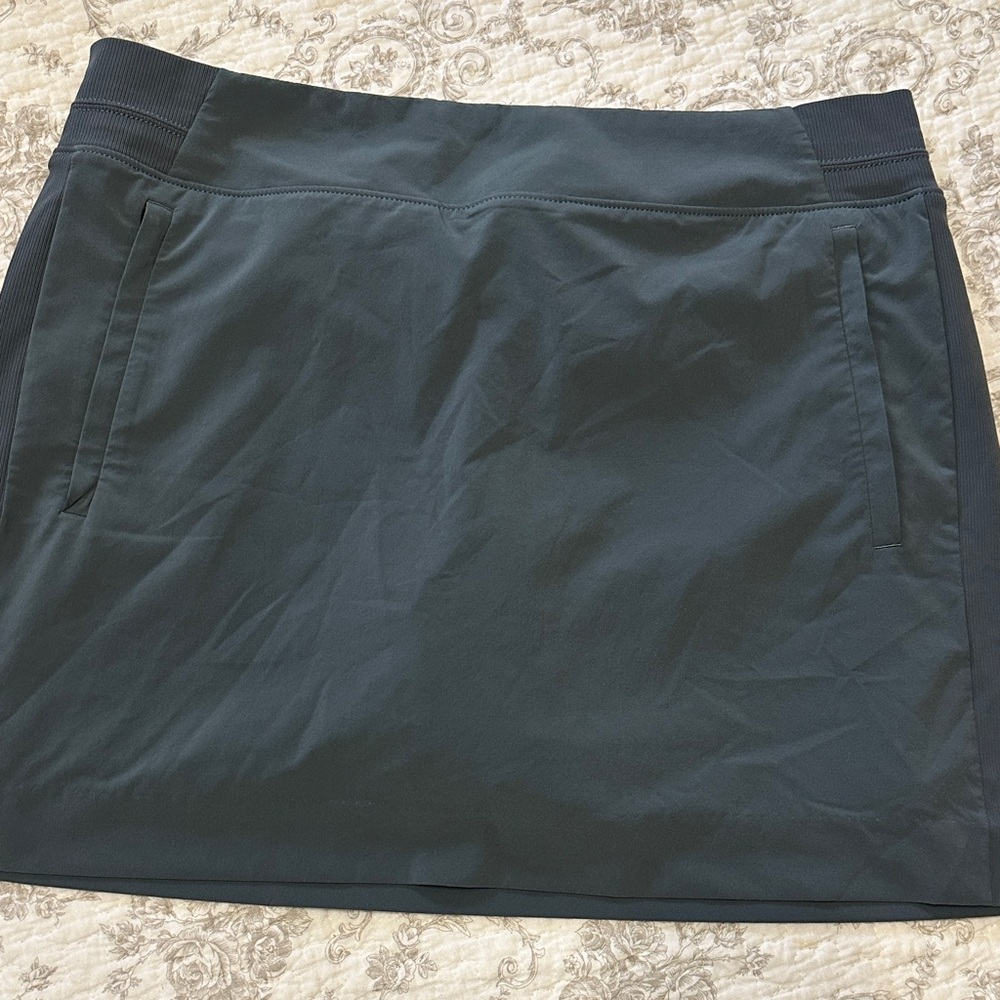 Athleta Women's Athletic Skirt with shorts and pockets.